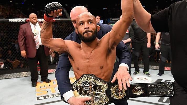 Demetrious Johnson wearing the UFC belt